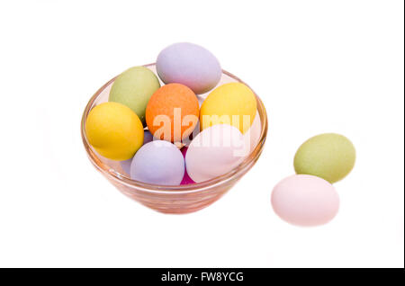 Colored eggs on a bowl over white background Stock Photo