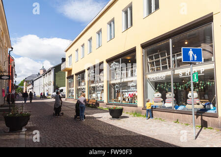 Porvoo, Finland - June 12, 2015: Street view of old Finnish town Porvoo with shops and people walking on pedestrian lane Stock Photo