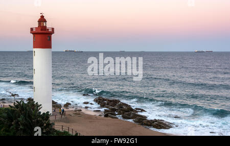 Sunrise on the Indian Ocean near the lighthouse at Umhlanga Rocks, north of Durban in KwaZulu Natal, South Africa. Stock Photo