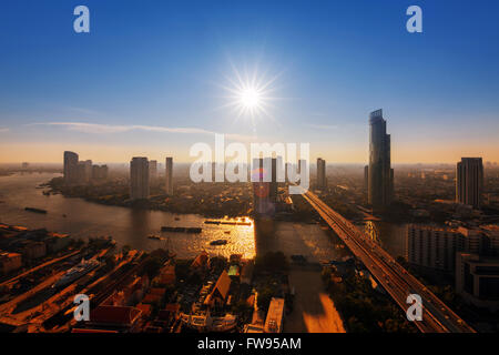 Chao Phraya river and high building sky scrapper in heart of bangkok thailand Stock Photo