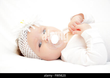little newborn girl lying on the bed Stock Photo