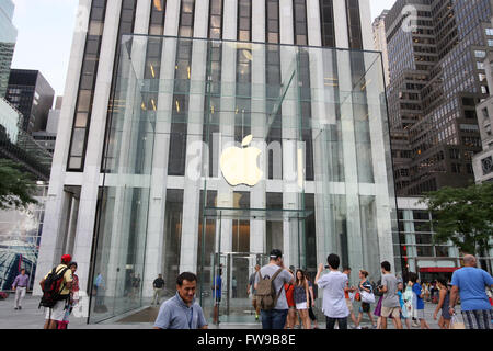 People enter the Apple store on 5th Avenue in New York City, NY., on Monday July 8, 2013. Stock Photo