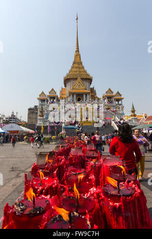 Row of candles at the Phra Maha Mondop of the Wat Traimit temple, candle donations for the Chinese New Year, Chinatown, Bangkok Stock Photo