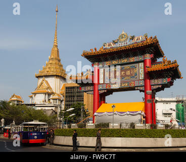 Entrance, Chinatown gate with Odeon Circle, District Samphanthawong, Phra Maha Mondop of Wat Traimit behind, Bangkok, Thailand Stock Photo