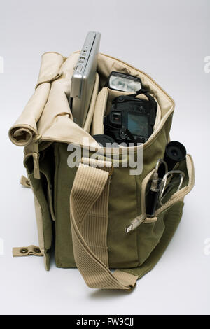 The camera, lens, flash and laptop in a bag Stock Photo