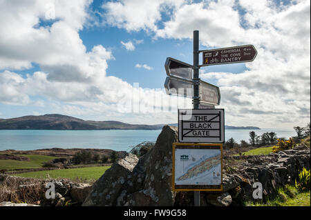 Selection of signs on a signpost on the Sheep's Head Way, West Cork, Ireland. Stock Photo