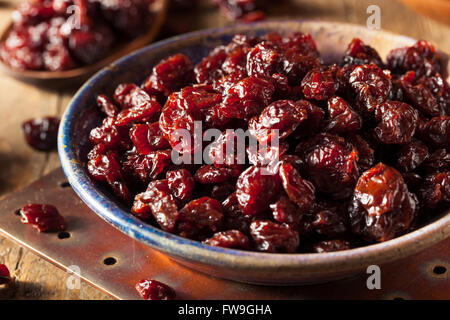 Organic Raw Dry Cherries in a Bowl Stock Photo