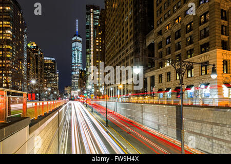 Traffic trails in downtown New York City at the entrance in Battery Park tunnel Stock Photo