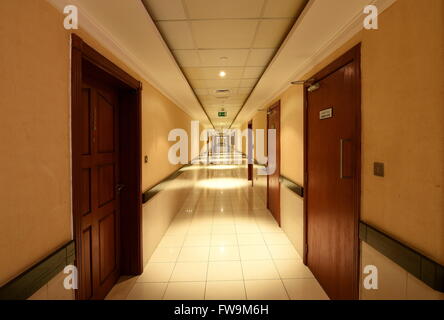 Long Corridor in the Building at night Stock Photo