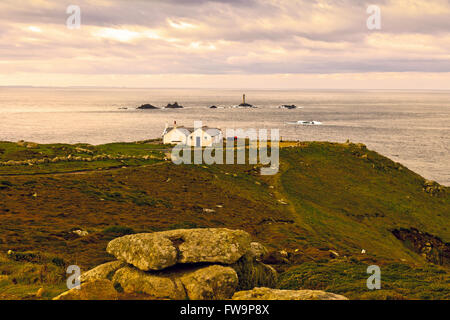 Longships lighthouse and the 'First and Last House' at Land's End, Cornwall, England, UK Stock Photo