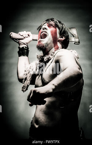 Portrait of screaming in rage ancient Spartan warrior in battle dress  against sky background Stock Photo - Alamy