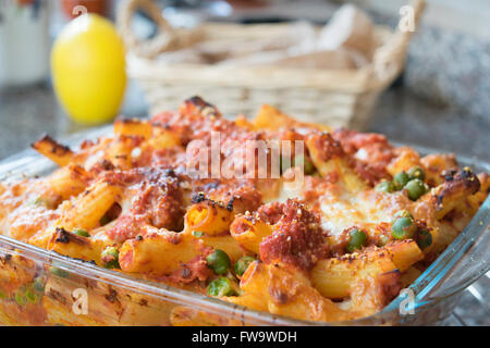 meaty baked rigatoni with peas bolognese ragout mozzarella and cheese Stock Photo