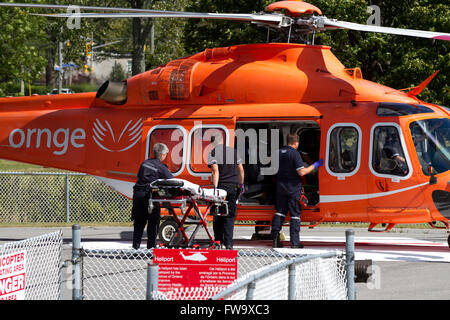 An Ornge air ambulance stands on a helipad near Kingston General Hospital(KGH) in Kingston Ont., on Thursday Aug. 14, 2015. Stock Photo