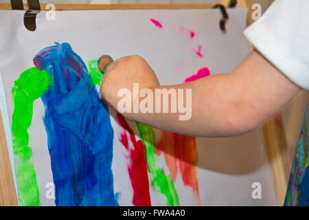 Child of 3 years old painting Stock Photo