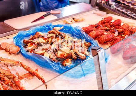Various seafood on the shelves of the fish market in Norway, Bergen Stock Photo