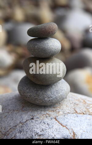 Round sea stones on top of each other Stock Photo