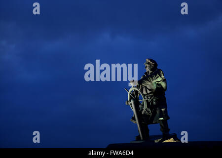 The bronze statue of lifeboatman Richard Evans which stands looking out to sea at the Meolfre Lifeboat Centre, Anglesey, Wales. Stock Photo