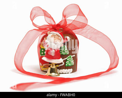 Santa Claus chocolate with red ribbon on white background Stock Photo