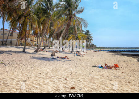 People lying on the beach in Cuba Stock Photo