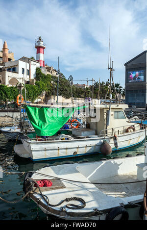 fishing boats in Jaffa, oldest part of Tel Aviv city, Israel. View with lighthouse on background
