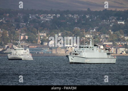 KNM Karmoy (left) and ENS Sakala (right), sit at anchor off Greenock Esplanade shortly after arriving for Joint Warrior 14-2. Stock Photo