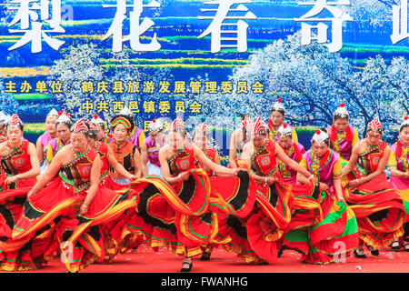 Heqing, China - March 15, 2016: Chinese women dressed with traditional clothing dancing and singing during the Heqing Qifeng Pea Stock Photo