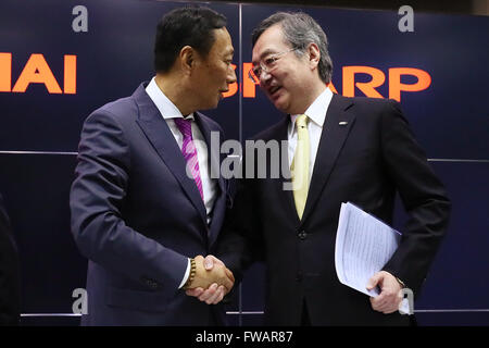 Osaka, Japan. 2nd April, 2016. Terry Gou (left), Founder and Chairman of Taiwanese electronics contractor Foxconn (official name Hon Hai Precision Industry Co., Ltd.), and Kozo Takahashi, President and CEO of Sharp Corporation, speak at a joint press conference held at Sakai Display Products Corporation on April 2, 2016 in Sakai Ward, Osaka, Japan. Gou and Takahashi announced the final terms for the deal for the Foxconn to acquire Japans Sharp at discounted rate on after a month of uncertainty. Credit:  Aflo Co. Ltd./Alamy Live News Stock Photo