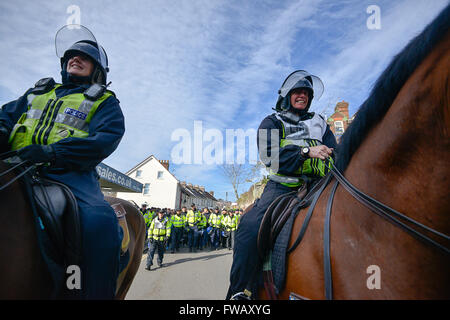 Exeter, Devon, UK. 2nd April, 2016. Avon & Somerset Police horses guide the Plymouth supporters back to the station Credit:  @camerafirm/Alamy Live News Stock Photo