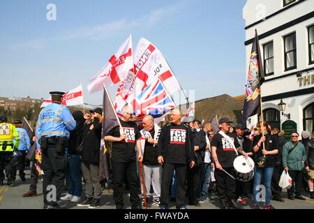 Dover, Kent, UK. 2nd April, 2016. EDL supporters outside the Priory Hotel. Anti-Fascist groups, including London Anti-Fascists, Kent Anti-Racism Network (KARN) and Unite Against Fascism (UAF), take to the streets of Dover to counter demonstrate a far right Unity march through the town center led by the right wing group South East Alliance,  which includes the National Front (NF) and English Defence League (EDL). Penelope Barritt/Alamy Live News Stock Photo
