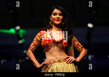 Kathmandu, Nepal. 2nd Apr, 2016. Former Miss Nepal Shristi Shrestha walks on the stage during the last day of TGIF Nepal Fashion week in Kathmandu, Nepal, April 2, 2016. The four-day fashion week presented both domestic and foreign designers' creations. © Sunil Sharma/Xinhua/Alamy Live News Stock Photo