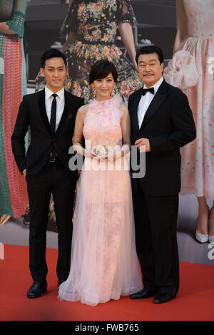 Hong Kong, China. 3rd Apr, 2016. Actress Angie Chiu (C) poses on the red carpet at the 35th Hong Kong Film Awards in Hong Kong, south China, April 3, 2016. © Qin Qing/Xinhua/Alamy Live News Stock Photo