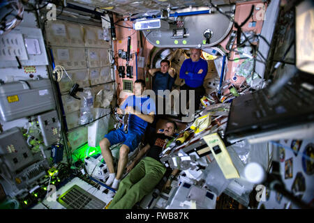 International Space Station Expedition 45 crew members watch an advance screening of The Martian movie in the Unity Node 1 September 19, 2015 in Earth Orbit. Clockwise from left, are Russian cosmonauts Oleg Kononenko and Sergei Volkov, NASA astronaut Scott Kelly, and cosmonaut Mikhail Kornienko. Stock Photo