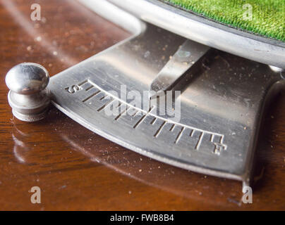 Speed regulator, or governor on an antique cabinet phonograph allowing to change speeds before 78 standardization Stock Photo