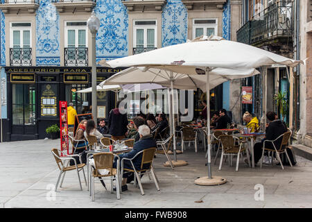 Outdoor cafe in a square of Ribeira district, Porto, Portugal Stock Photo