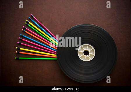 Wooden writer desktop with colorful pencil and movie film reel Stock Photo