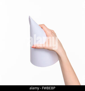 The white cone of the props in the female hands on white background with  right shadow Stock Photo