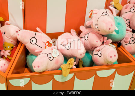 Toy box  full of Peppa Pigs soft toys Stock Photo