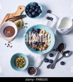 Several bowls filled with healthy and nutritious ingredients for tasty breakfast Stock Photo