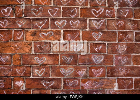 Chalked love hearts on a wall in Glastonbury, Somerset, England Stock Photo