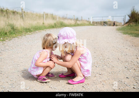 two girls crouching Stock Photo