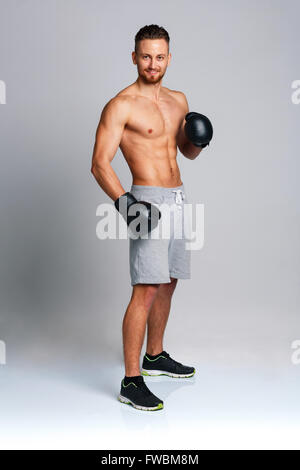Sport attractive man wearing boxing gloves Stock Photo