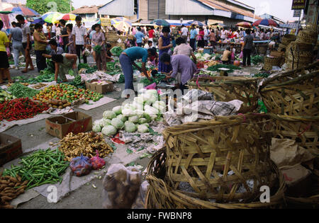 An early morning fruit and vegeatble market in the old town / city of Ipoh in Malaysia which is about 200km north of the captial Kuala Lumpur. Packed with locals searching for fresh food it is a sight that the adventurous traveller or back packer may see on theor travels off of the main toursit routes and city centre attractions. Stock Photo