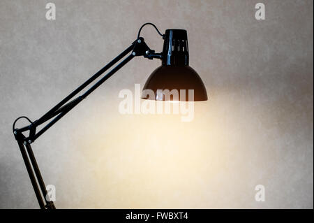 Vintage black reading table lamp turn on in room Stock Photo