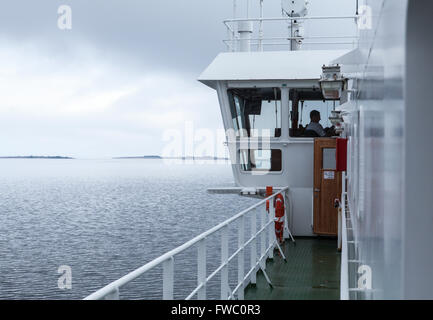 BALTIC SEA, ALAND ON JUNE 27, 2013. View of the bridge on a ferry, ship in the archipelago. Unidentified person. Editorial use. Stock Photo