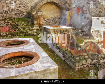 Remains Of Food and Drinks Shop Herculaneum Campania Italy Stock Photo