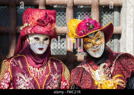 Masks at the Venice Carnival in St. Mark's Square, Venice, Veneto, Italy. Stock Photo