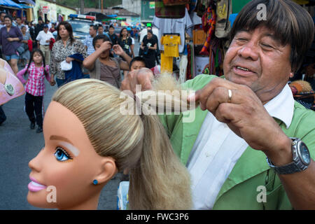 Wig seller in the Antigua streets, Guatemala.