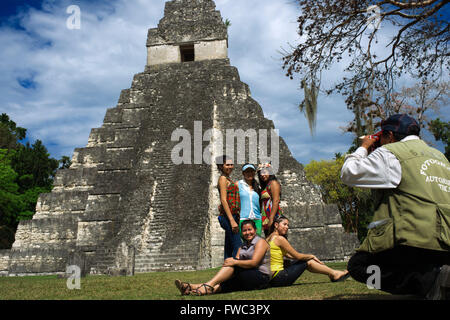 Local photographer at Tikal Pyramid ruins (UNESCO site), Guatemala. Great Jaguar Temple (Temple I) Pre-Columbian Maya Site at Ti Stock Photo