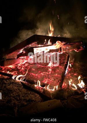 Bonfire Coals Glowing in the Dark of the Night Stock Photo