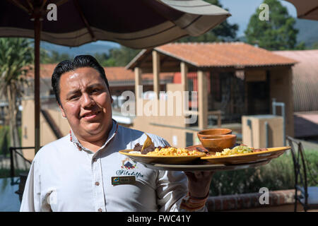 Waiter with the breakfast in Filadelfia coffee estate, R. Dalton Coffee Company, Antigua, Guatemala. Stock Photo